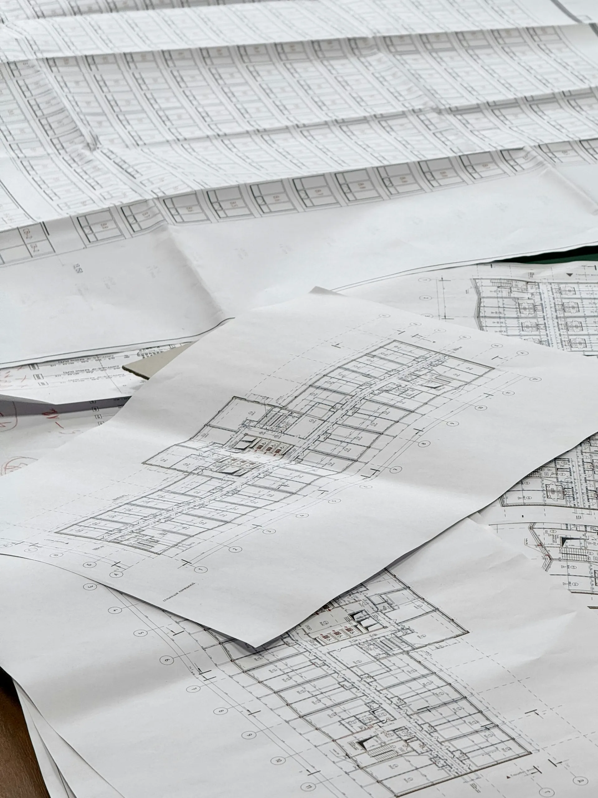 Engineering drawings spread out on a desk