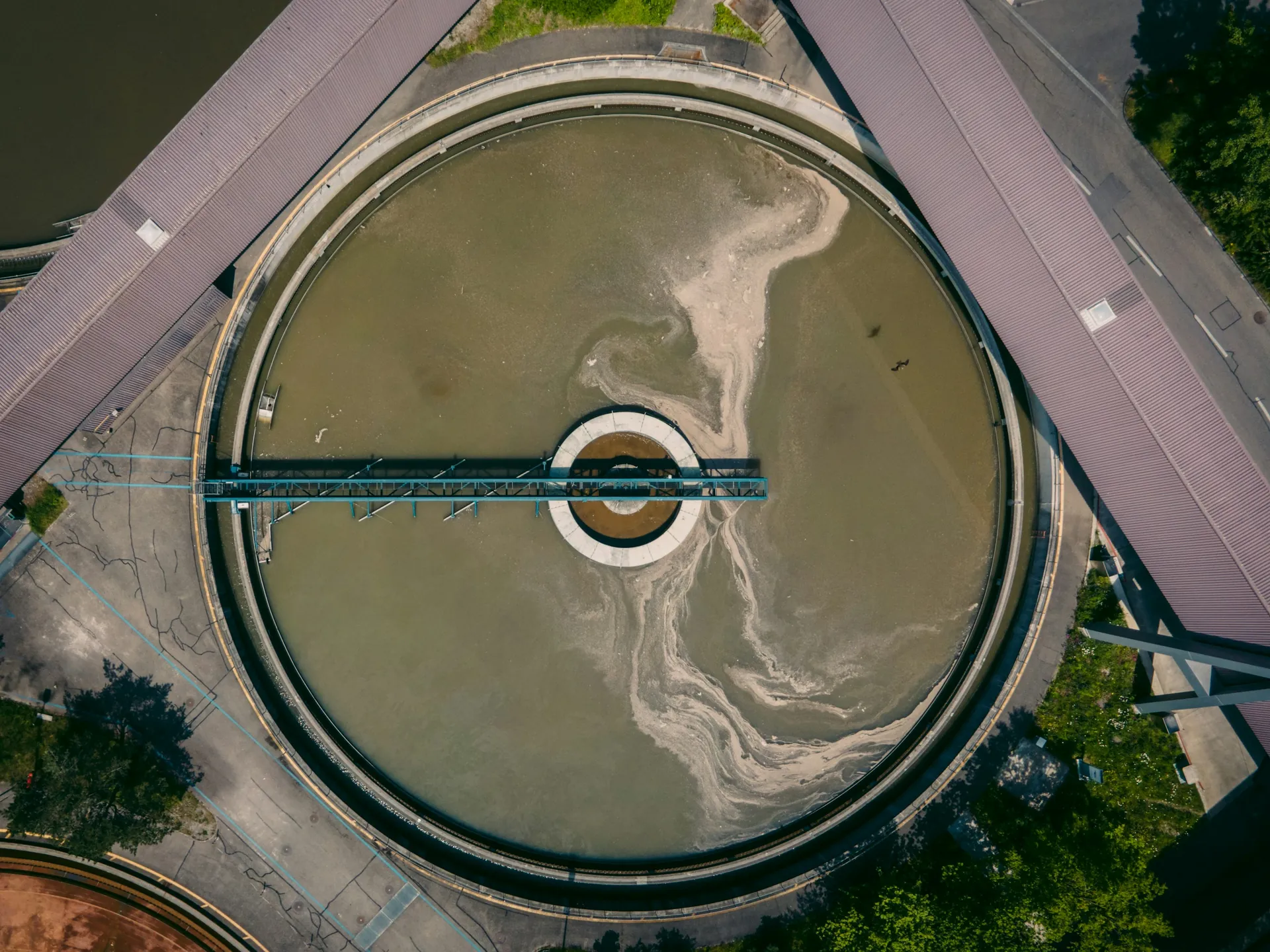 Overhead view of a circular clarifier with a rotating bridge
