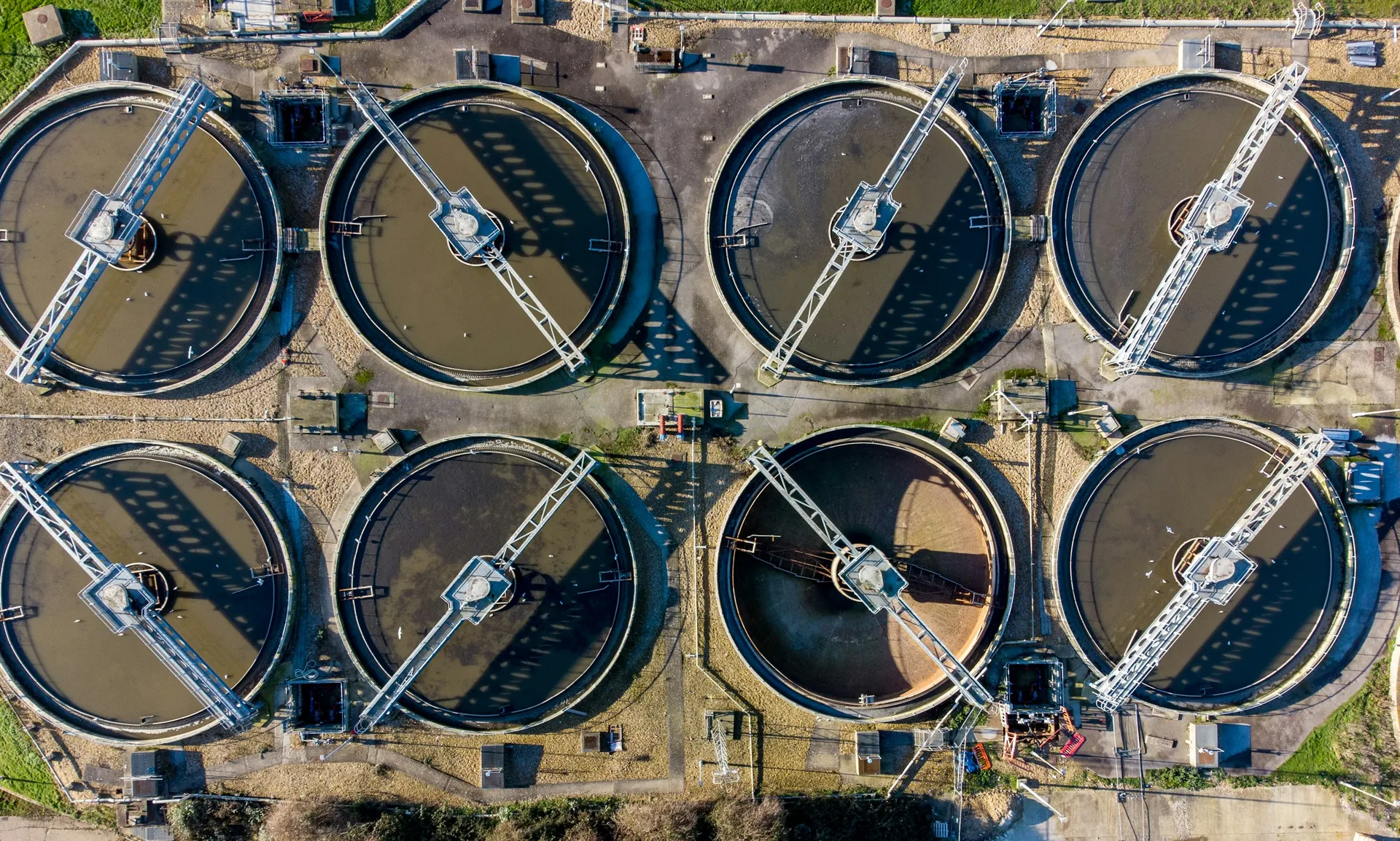 Aerial view of circular clarifiers at a wastewater treatment plant