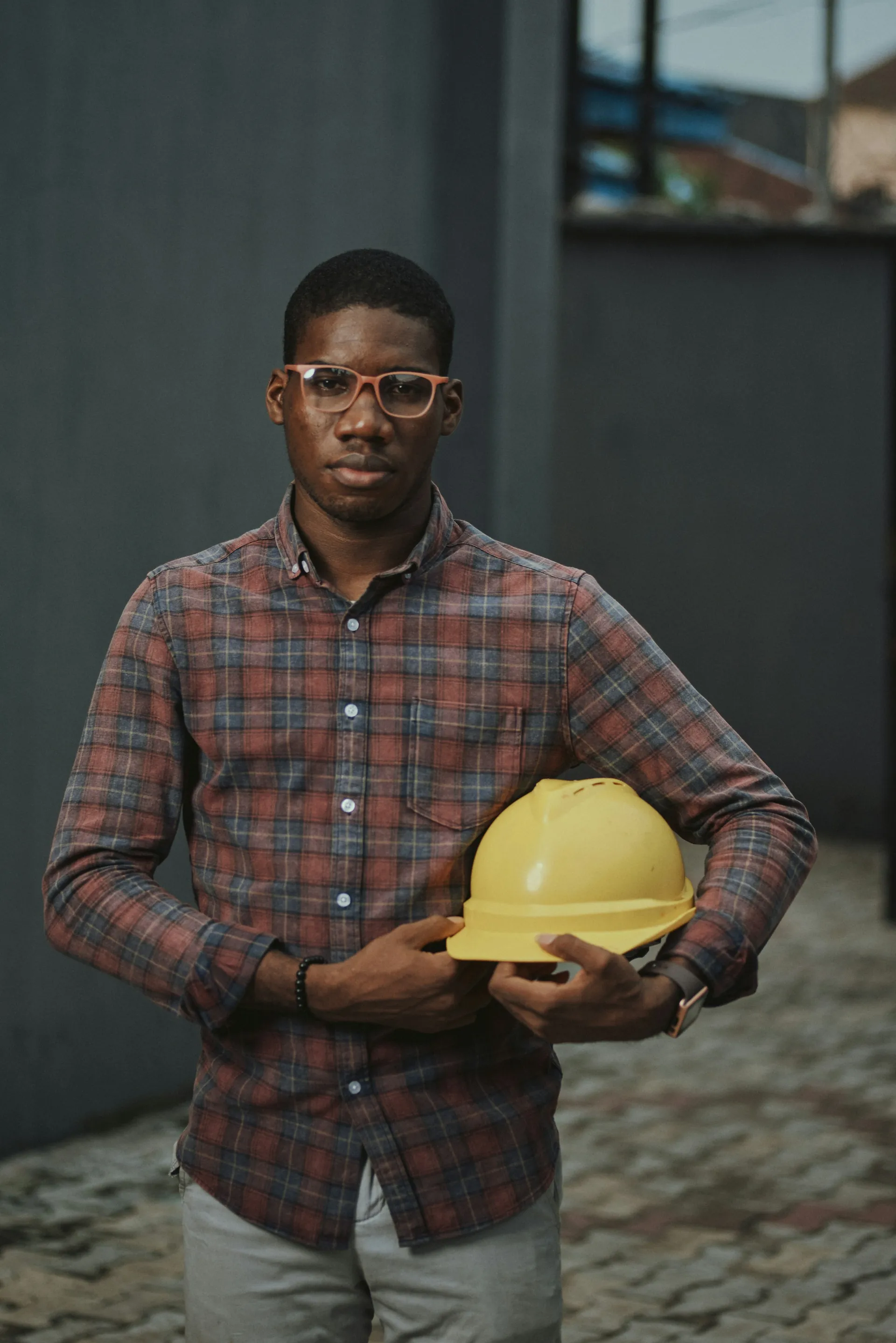Engineer holding a yellow hard hat