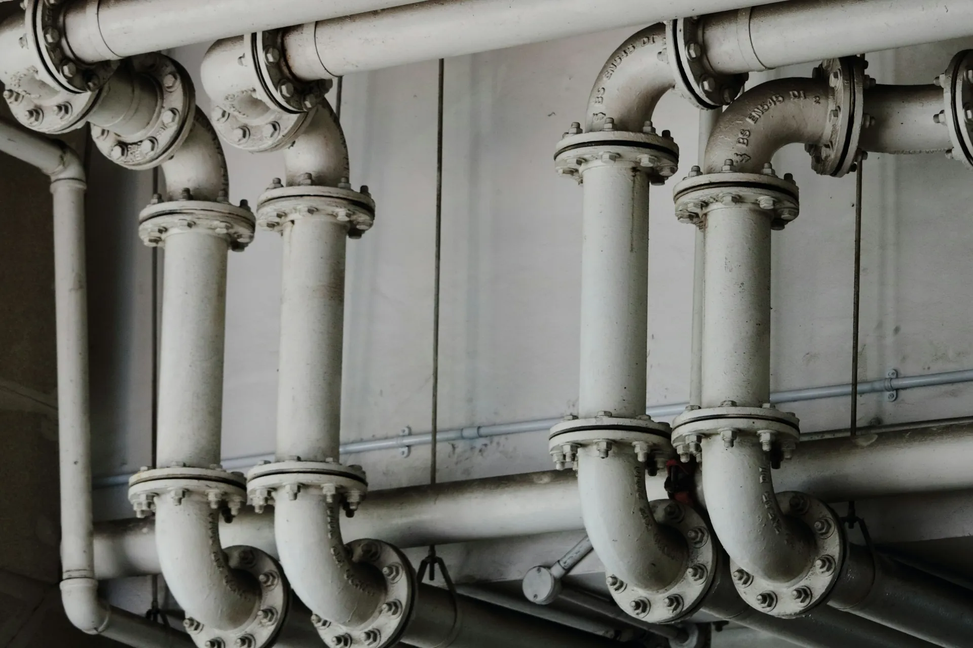 Black-and-white view of industrial process piping