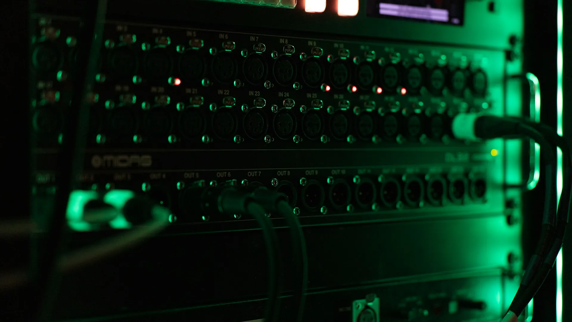 Network equipment with green status lights in a server rack
