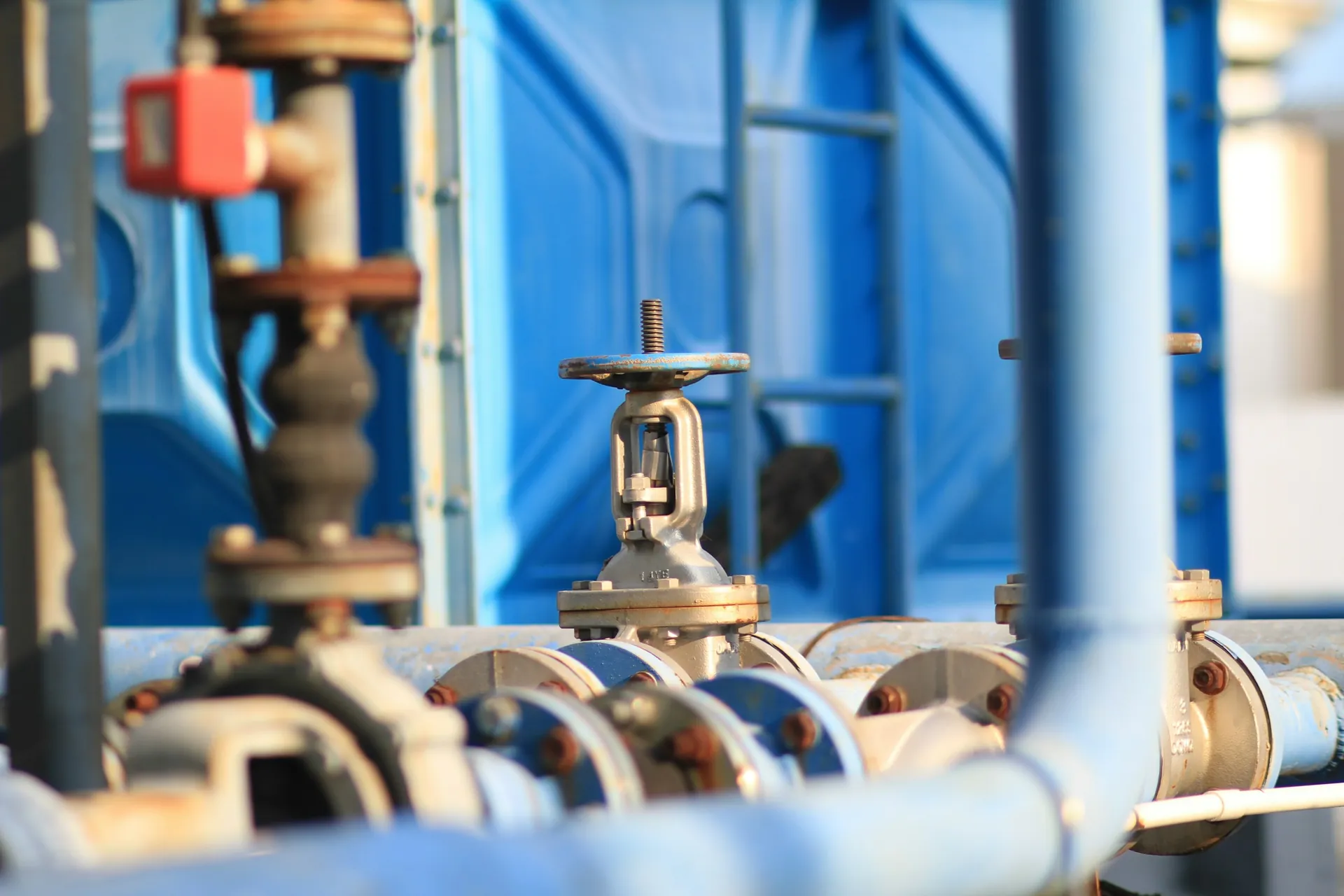 Close-up of valves and pipework in a treatment facility