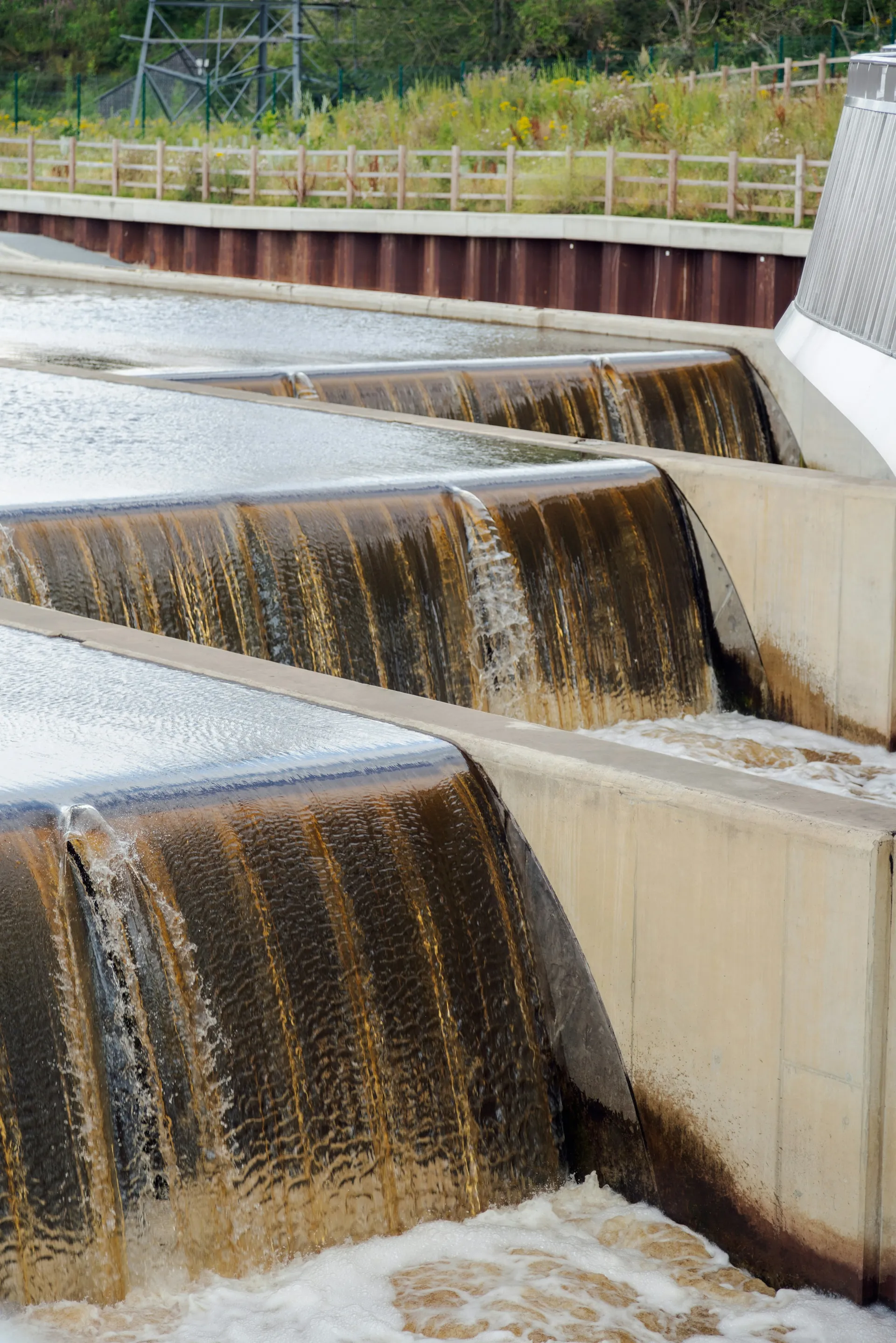 Water flowing over stepped concrete weirs